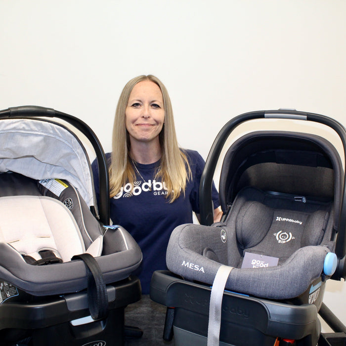 Amanda, GoodBuy Gear's In-House CPST holding two car seats