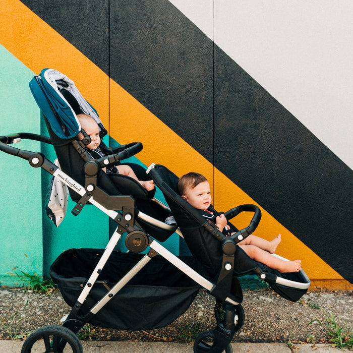 Mockingbird single to double stroller with two kids in it