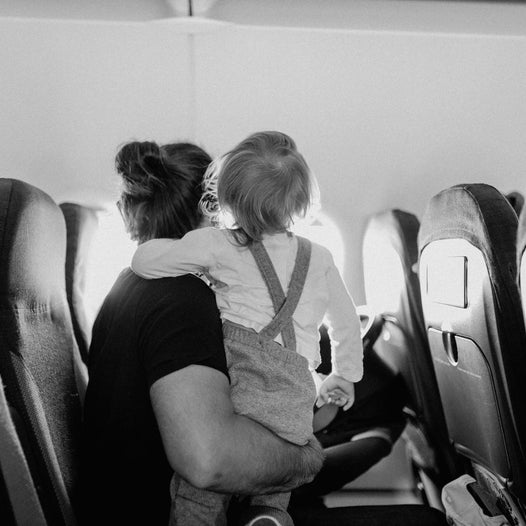 Mom with her toddler on an airplane