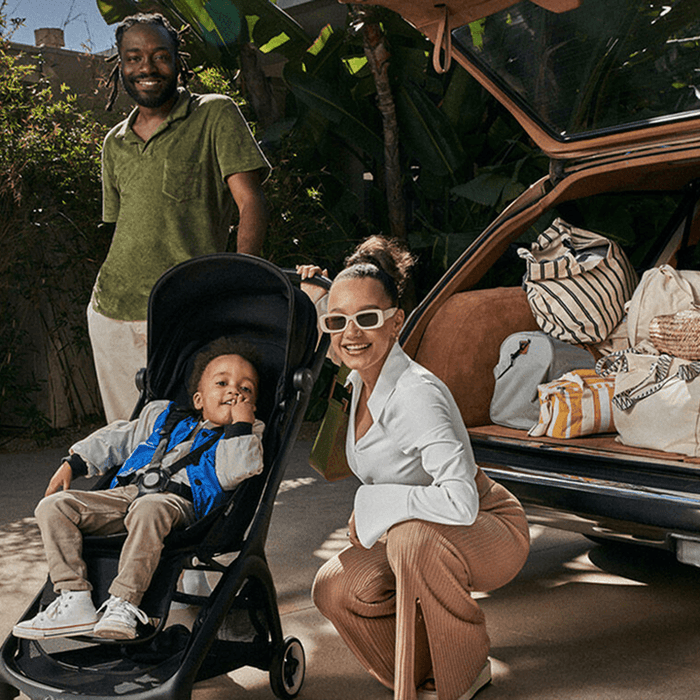 Bugaboo travel stroller with family packing the car