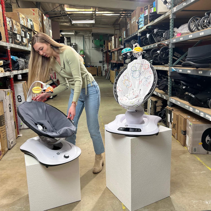 Our gear expert standing next to the MamaRoo and RockaRoo