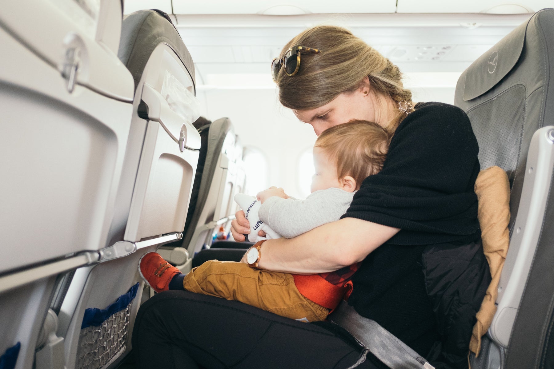 Mom on a plane with her toddler 