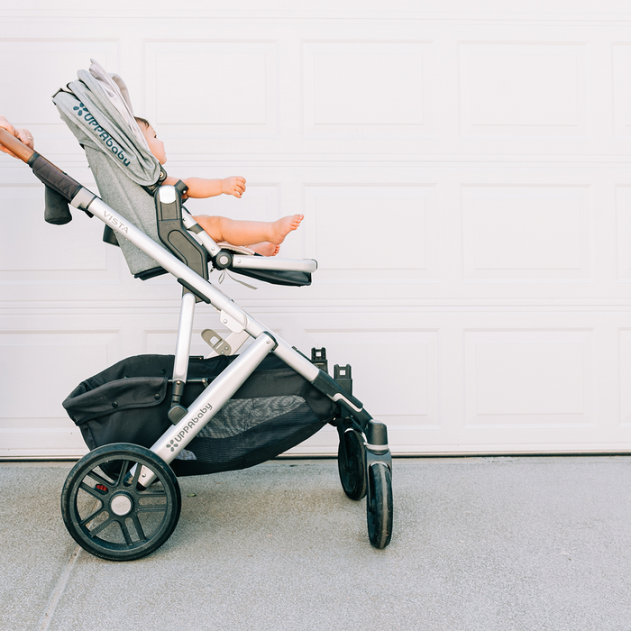 Tall parent pushing the UPPAbaby Vista V3 Stroller