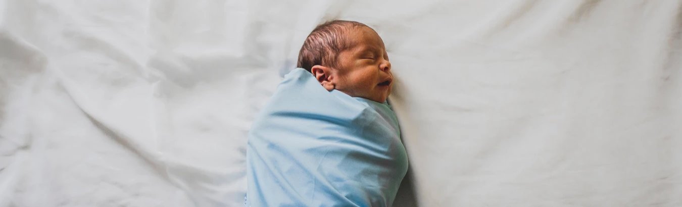 baby sleeping in a swaddle