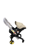 Shop Doona Infant Car Seat & Stroller Combo, 2024, Limited Edition Beige/Warm Stone at GoodBuy Gear