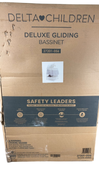 Shop Delta Children Deluxe Gliding Bassinet, Silver Lining at GoodBuy Gear