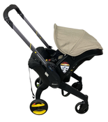 Shop Doona Infant Car Seat & Stroller Combo, 2024, Warm Stone at GoodBuy Gear