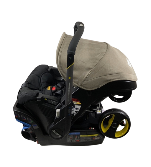 Shop Doona Infant Car Seat & Stroller Combo, 2024, Warm Stone at GoodBuy Gear