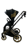Shop Cybex E-PRIAM Electric Stroller, 2022, Gold With Black Details, Wings By Jeremy Scott, with Battery at GoodBuy Gear