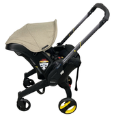 Shop Doona Infant Car Seat & Stroller Combo, 2024, Warm Stone at GoodBuy Gear