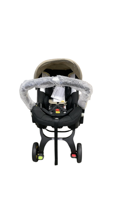 Shop Doona Infant Car Seat & Stroller Combo, 2023, Limited Edition Beige/Warm Stone at GoodBuy Gear