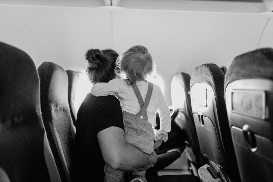 mom and kid on an airplane