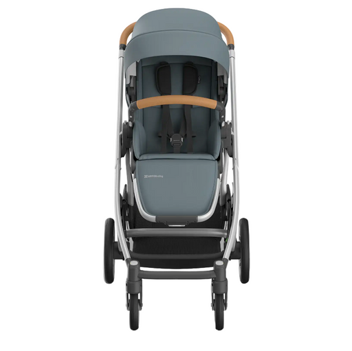 Gray stroller with brown accents on a white background