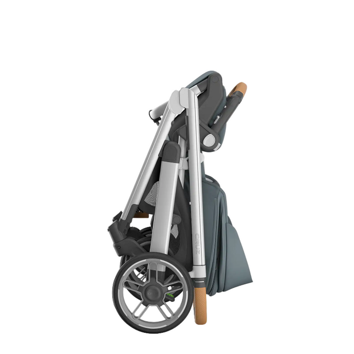 Folded stroller with a carrying bag on a white background
