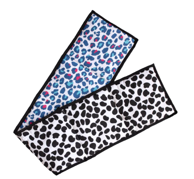 Two leopard print towels, one blue and pink, one black and white, on a light gray background.