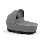 Cybex PRIAM Lux Carry Cot in Soho Grey color with a breathable mattress and a big sunshade.