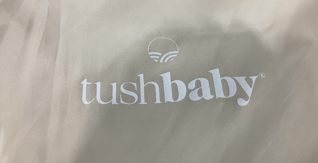 Shop Tushbaby Pearl Newborn Carrier, Cream at GoodBuy Gear