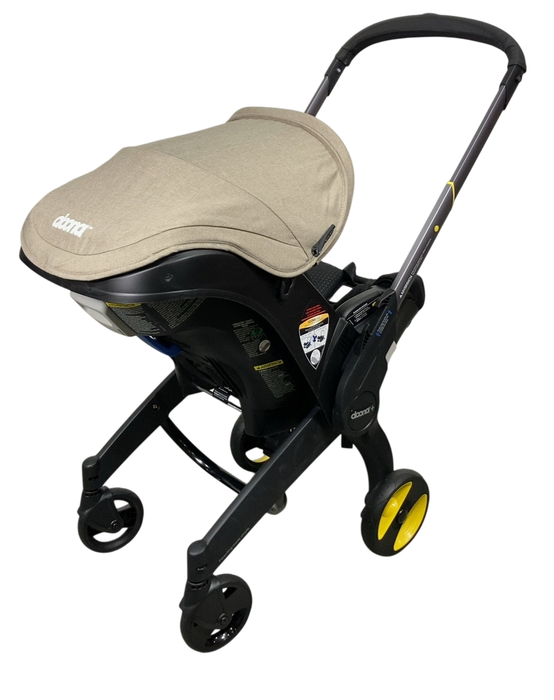 Shop Doona Infant Car Seat & Stroller Combo, 2024, Warm Stone at GoodBuy Gear