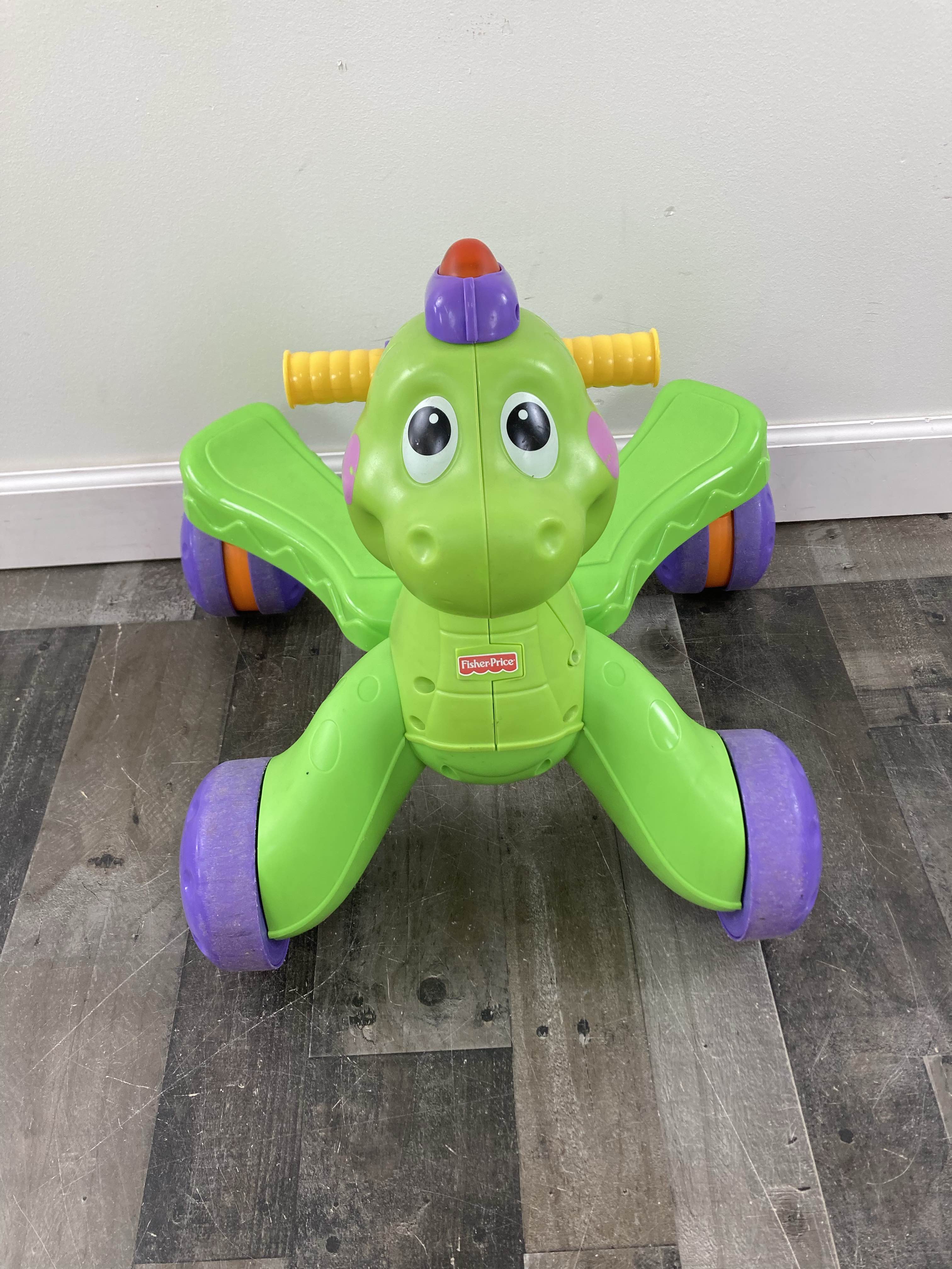 Fisher price ride on clearance dinosaur