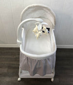 used Delta Children Deluxe Gliding Bassinet