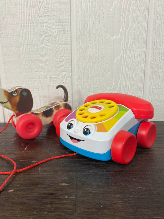 used Fisher Price Chatter Telephone, And Dog Pull toy 