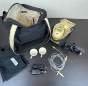 used Medela Freestyle Breast Pump, with Medium Pumping Bra and Tote