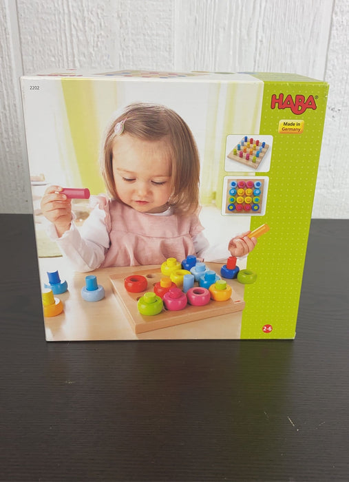 used HABA Rainbow Wheels Pegging Game