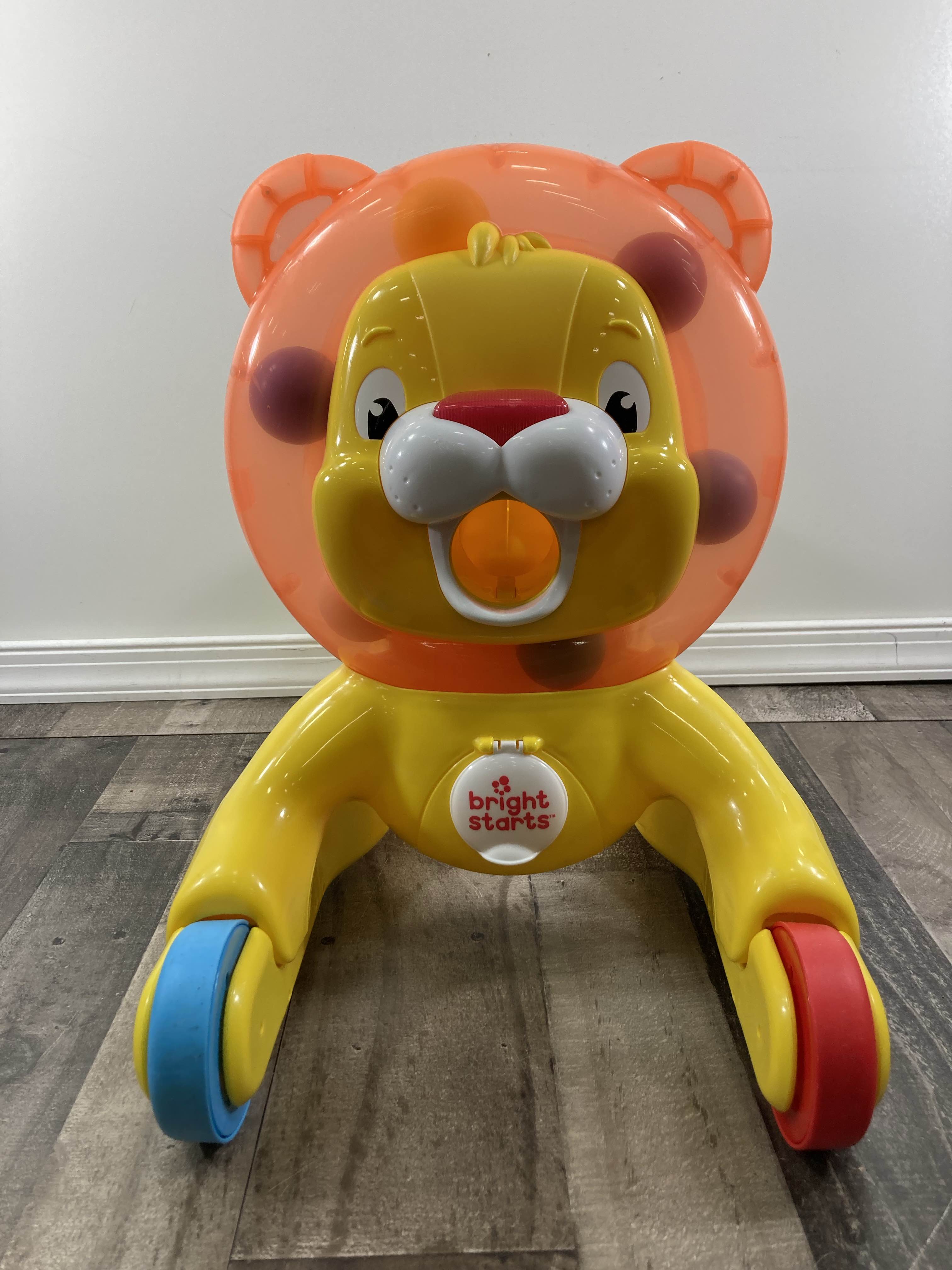 Bright starts lion ride hot sale on