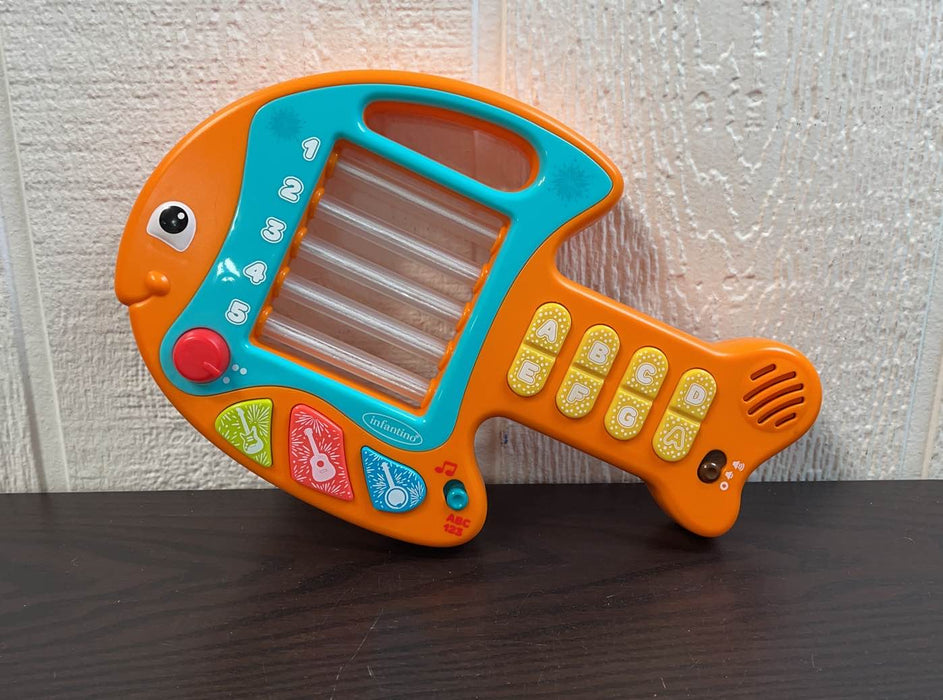 used Infantino Lights & Music Learning Fish Guitar