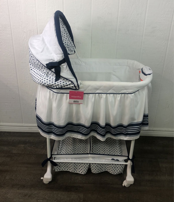 used Delta Children Deluxe Gliding Bassinet