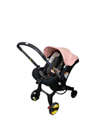 used Doona Infant Car Seat & Stroller Combo, Blush Pink, 2023