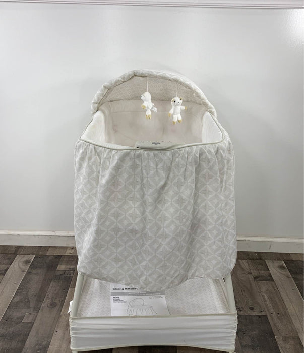 used Delta Children Deluxe Gliding Bassinet