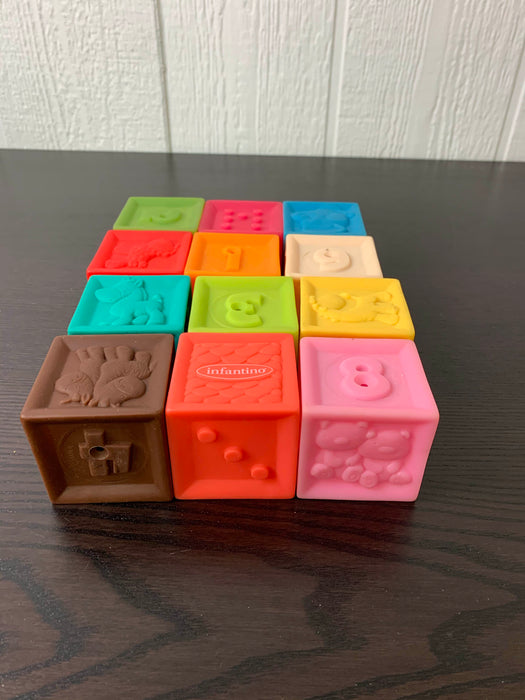 used Infantino Squeeze & Stack Block Set