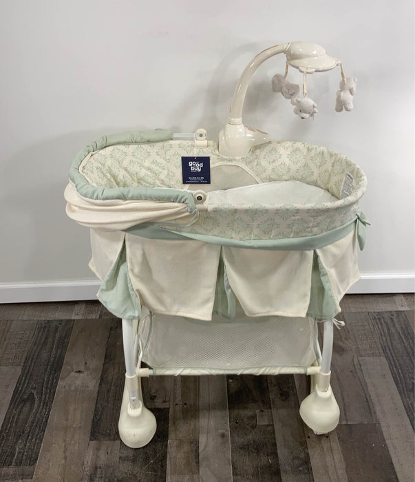 used Kolcraft Cuddle 'n Care Rocking Bassinet with Light Vibes Mobile