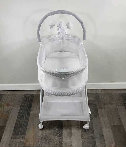 used Delta Children Wave Vibrating Bassinet With Toy Bar