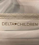 secondhand Delta Children Deluxe Gliding Bassinet