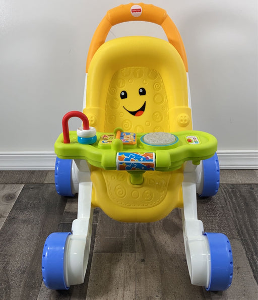 used Fisher Price Stroll & Learn Walker