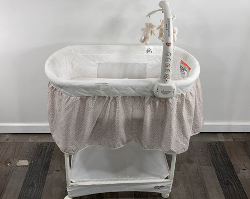 used Delta Children Deluxe Gliding Bassinet