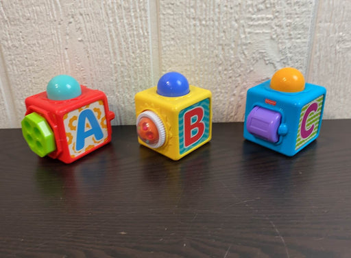 secondhand Fisher Price Brilliant Basics Stacking Action Blocks