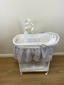 used Delta Children Deluxe Gliding Bassinet