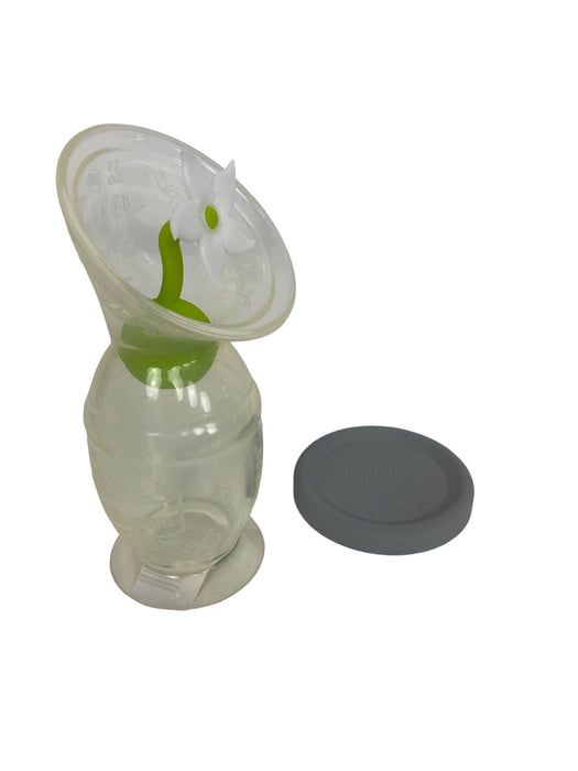 used Haakaa Silicone Breast Pump And Flower Stopper Set