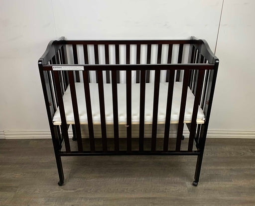 used Delta Children Mini Folding Portable Crib