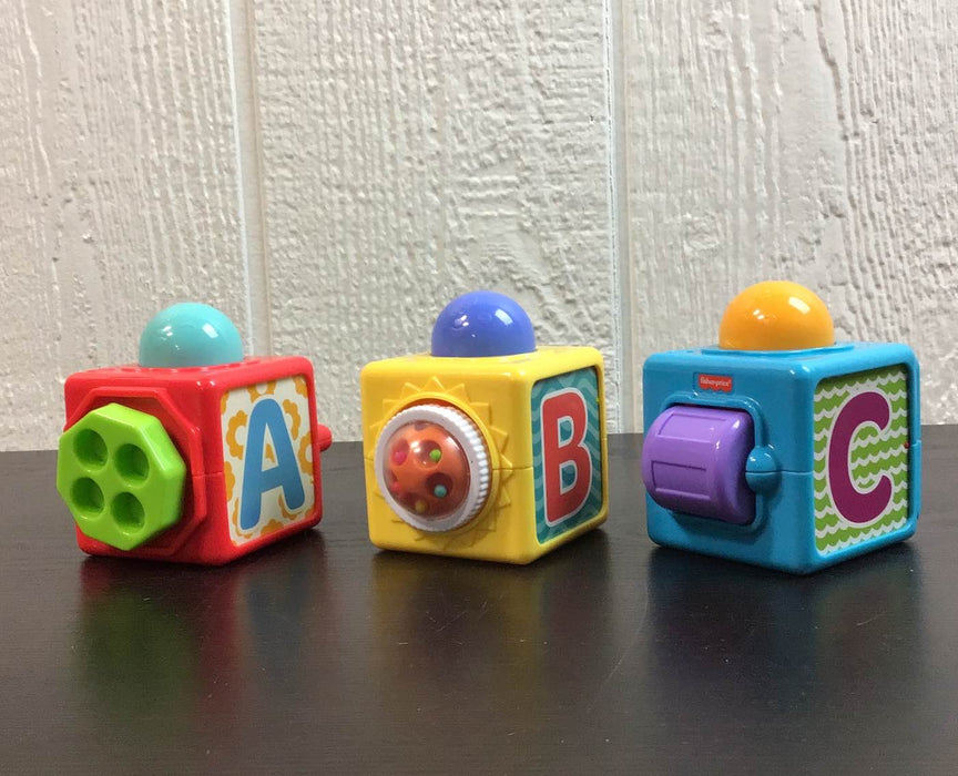 used Fisher Price Brilliant Basics Stacking Action Blocks